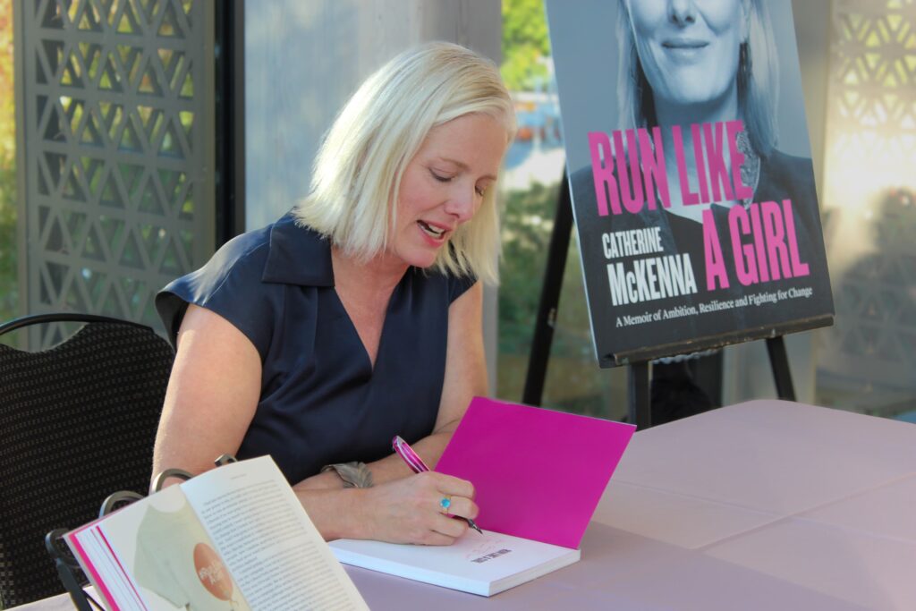 Catherine McKenna signing her new book at the launch